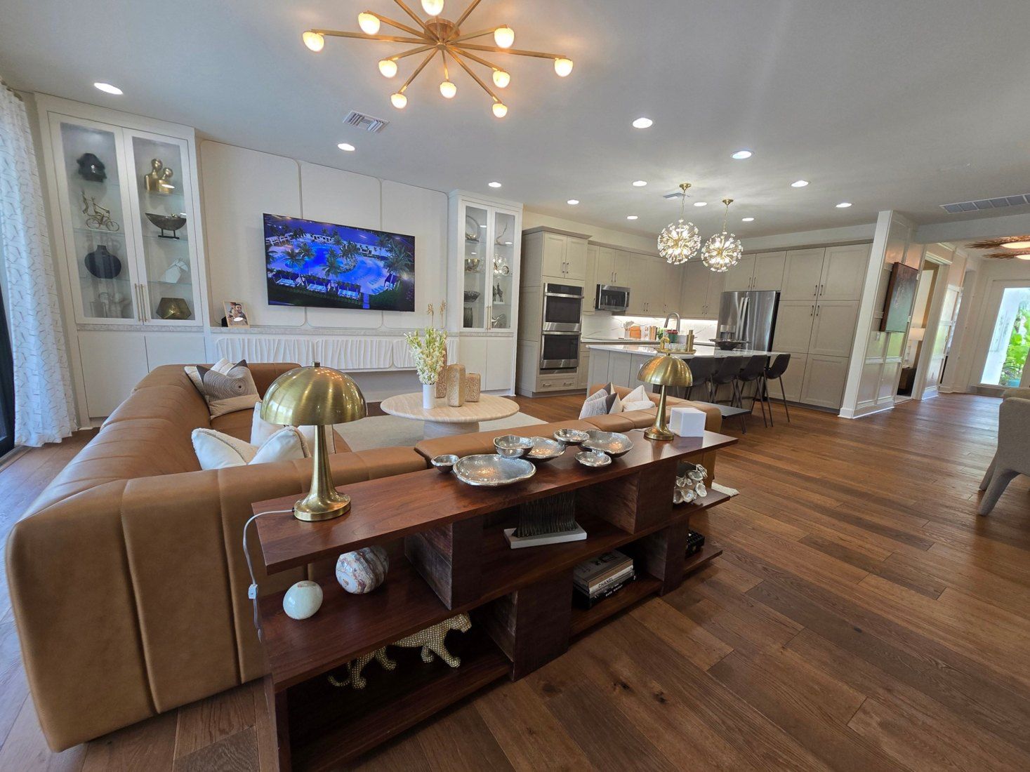 Great room with a built-in media wall and display cabinets (example style photo)